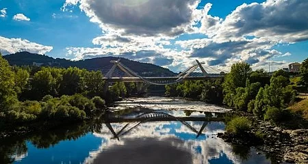 Millennium Bridge reflected in the Miño River in Ourense._348